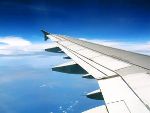 Aeroplane wing and blue sky