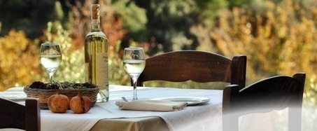 Crete Honeymoon - dinner table set for two with white wine