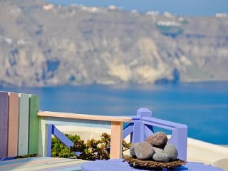 View across the caldera from your private Santorini balcony
