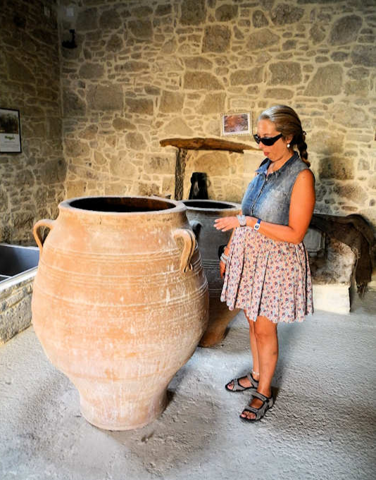 Ancient jars which were used to store olives and olive oil on display inside the Kamilari Fabrica