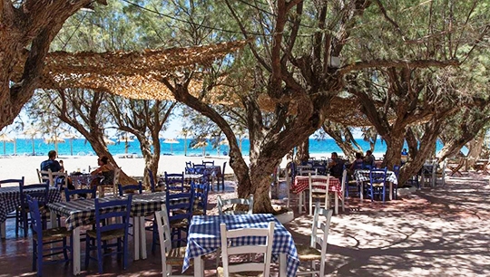 Kokkinos Pirgos Taverna tables in shade