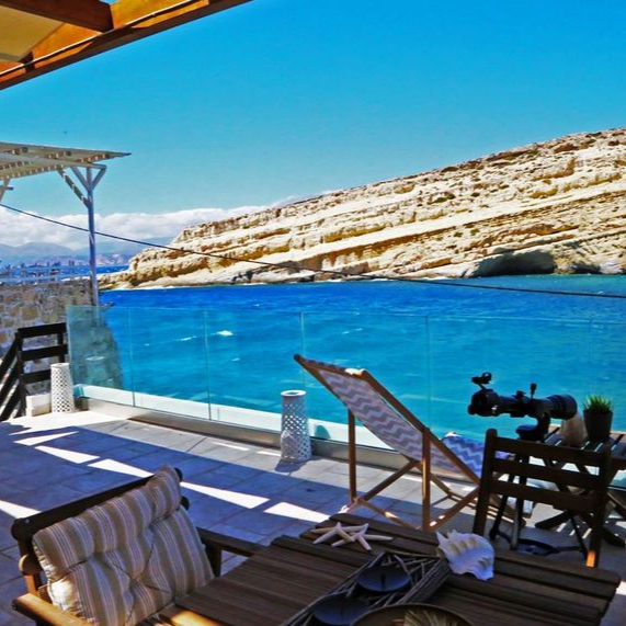 Matala Caves Seafront Apartment looks across the bay to the ancient caves on the rocky peninsula