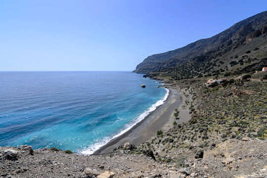 Pachia Ammos Beach, which means 'big sand' beach, this is a magnificent wide grey sandy beach with pebbles, no buildings and just pure seaside and wide open spaces for your heart to run wild.