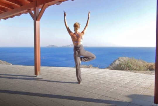Yoga overlooking the sea in Crete