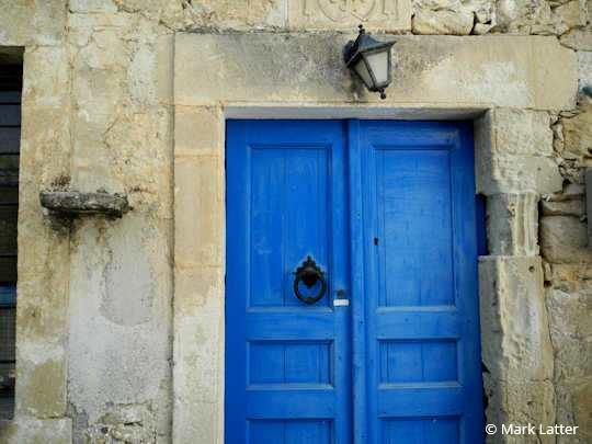 An old door with character in a small village in Crete