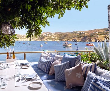 Sit at this outdoor restaurant at the Out of the Blue Resort overlooking Agia Pelagia Bay