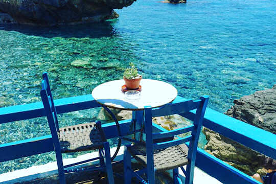 Table for two next to the blue at Agia Fotia Taverna, in southern Rethymnon, Crete