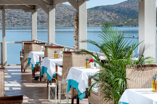 Elounda Akti Olous - view from taverna across the by with fishing boat