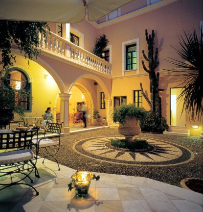 The delightful, atmospheric courtyard of the Casa Delfino luxury hotel in Chania Old Town