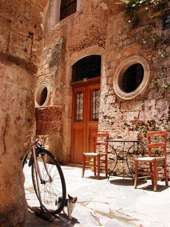 Chania old town walls, a cycle and kitten (image by Irene Shin)