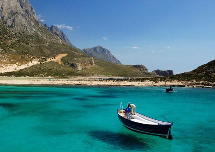 Balos Lagoon - clear turquoise waters, fishing boat