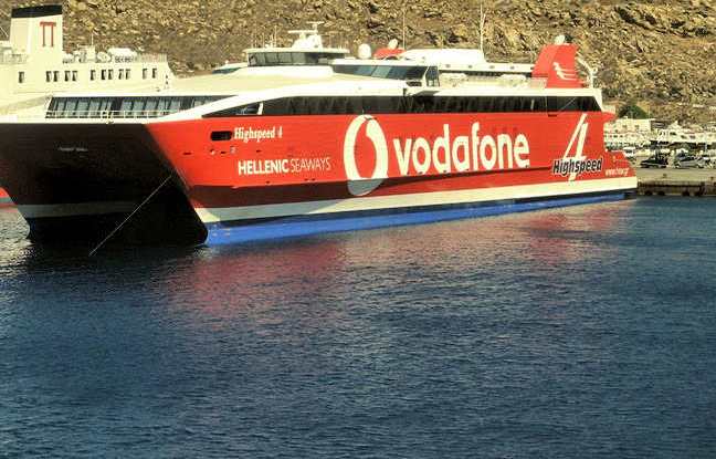 Ferries to Crete - big red Hellenic Seaways ferry docked at Mykonos island