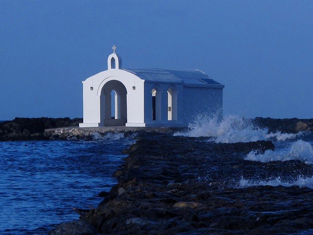 Romantic dusk envelopes the little chapel of Agios Nikolaos at Georgioupolis