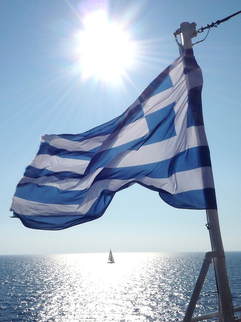 Blue and white of the Greek flag against the blue and white of the Mediterranean sea