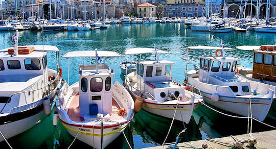 Heraklion Old Harbour fishing boats and Venetian Arsenals