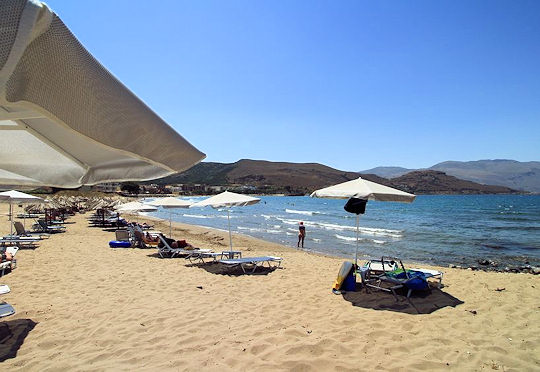 Beach with umbrellas - white sand and clear waters