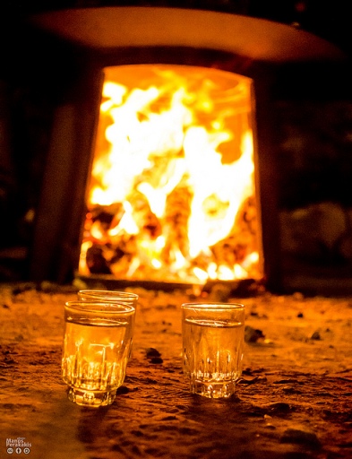 Kazani fire and glasses of raki (image by Manos Perakakis)