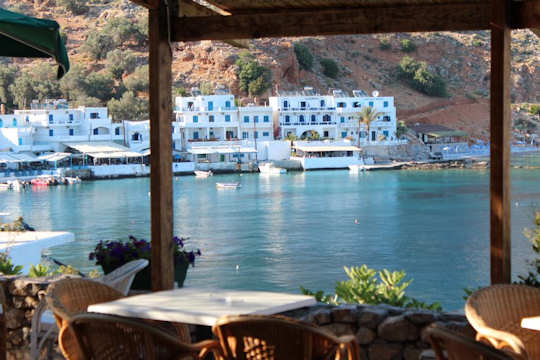 Porto Loutro on the western side of the bay has lovely views from its own taverna across the bay to the village