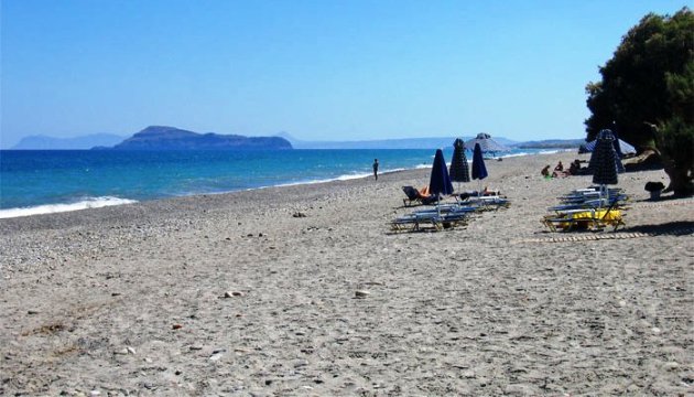 White sand, blue umbrellas, lots of sun