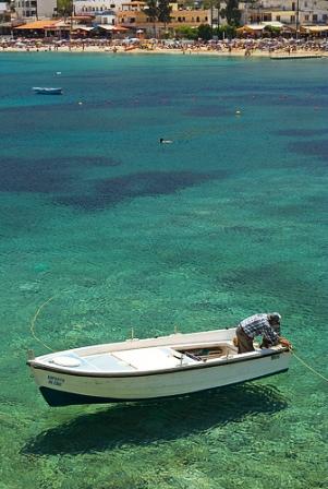 Clear waters and fishing boat Crete (Image by Micael Goth)
