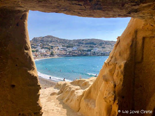 Matala Beach - here the bay can be seen framed by the walls of one of the ancient burial caves on the peninsula