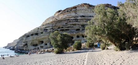 The western end of Matala Beach with the caves and tamarisk trees