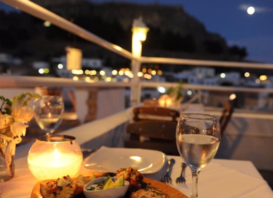 Enjoy a romantic evening for two in Lindos at Kalypso Restaurant, request seating on the rooftop