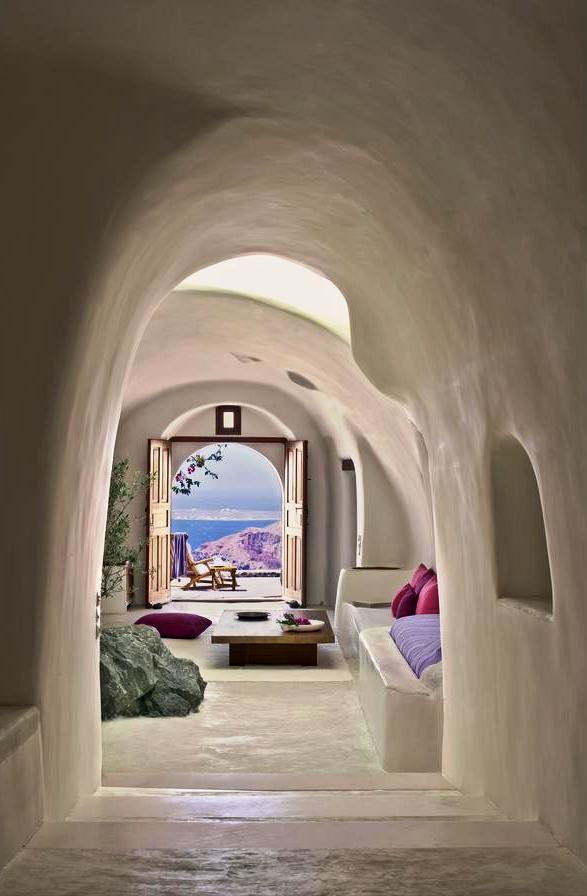 Experience the atmosphere of ancient Santorini by staying in a cave hotel. The modern hotels are very comfortable, nestled into the rock, with spectacular views. Such colours and perspective.