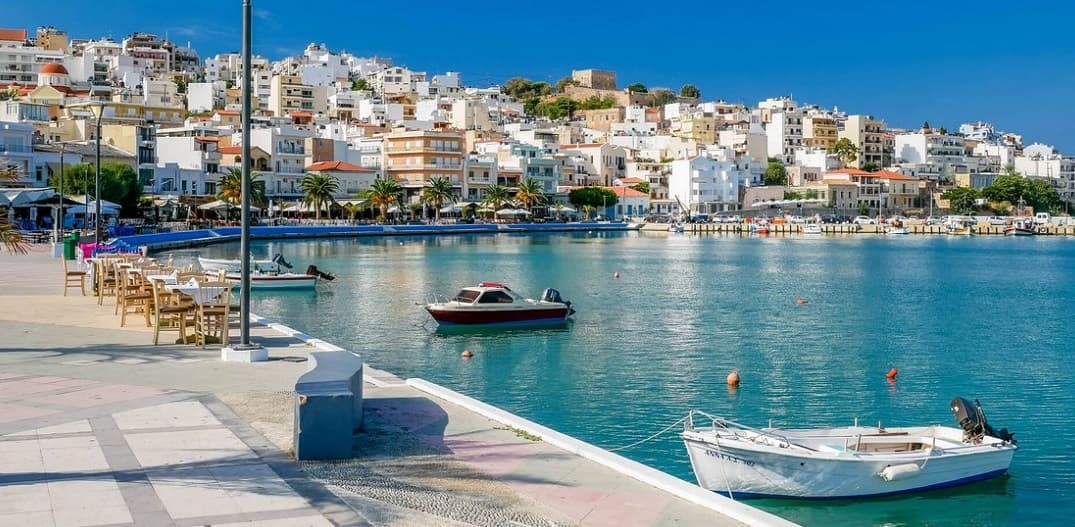 The town and harbour showing the relaxing esplanade with its palm trees...