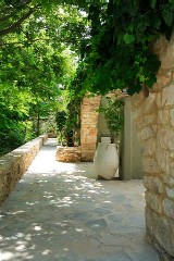 Sitia Spa Resort - exterior traditional walls and gardens