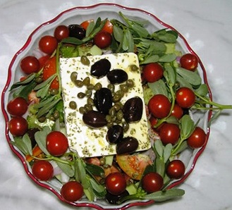 Fresh salad made by Evangelia - greens, olives, feta