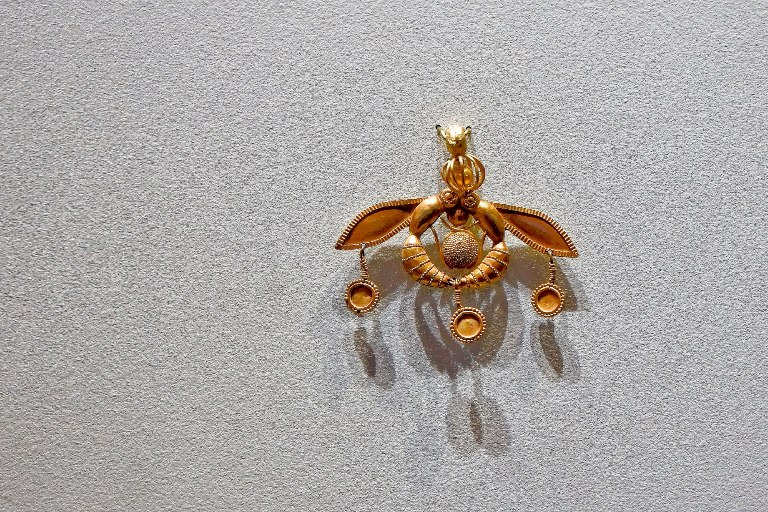 The Bee Pendant was discovered at Malia Palace ancient Minoan site and is displayed at the Heraklion Archaeological Museum