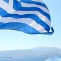 Info for Your Greek Holidays - picture of Greek flag off the back of the ferry